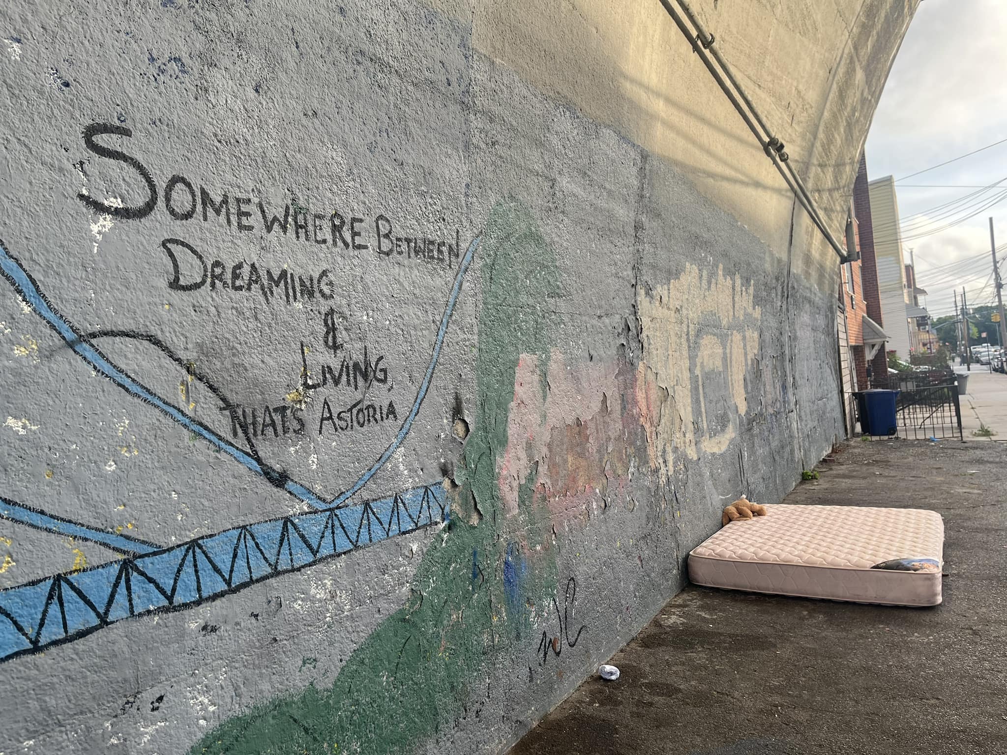 This meme is an image of a person sleeping on the streets, with a cardboard box and a trash can nearby. The text "In a world where... you can sleep on the streets and still get a good night's sleep" is written above the person, implying that the streets are so comfortable that even the homeless can get a good night's sleep.